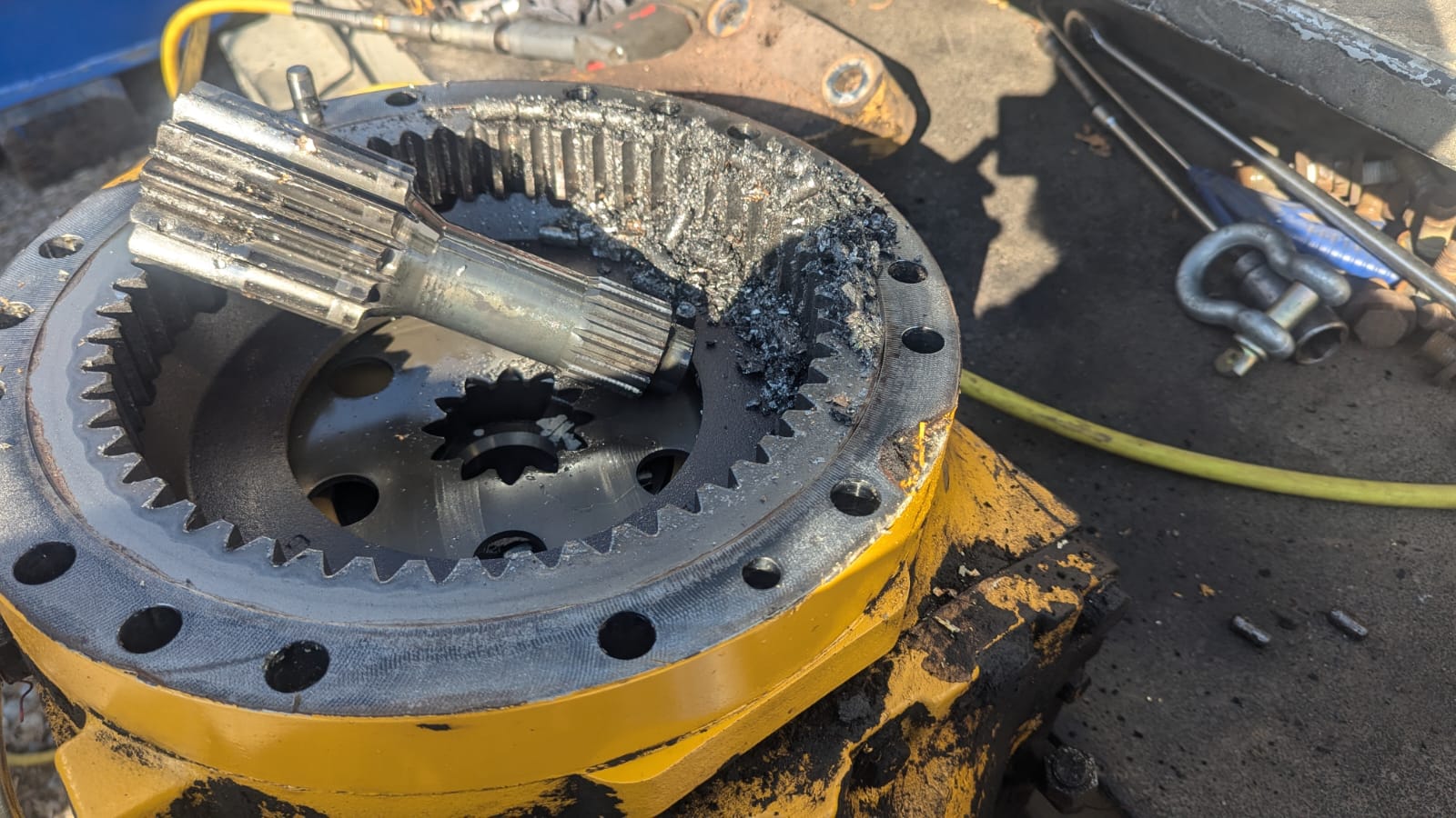 Damaged final drive components under inspection