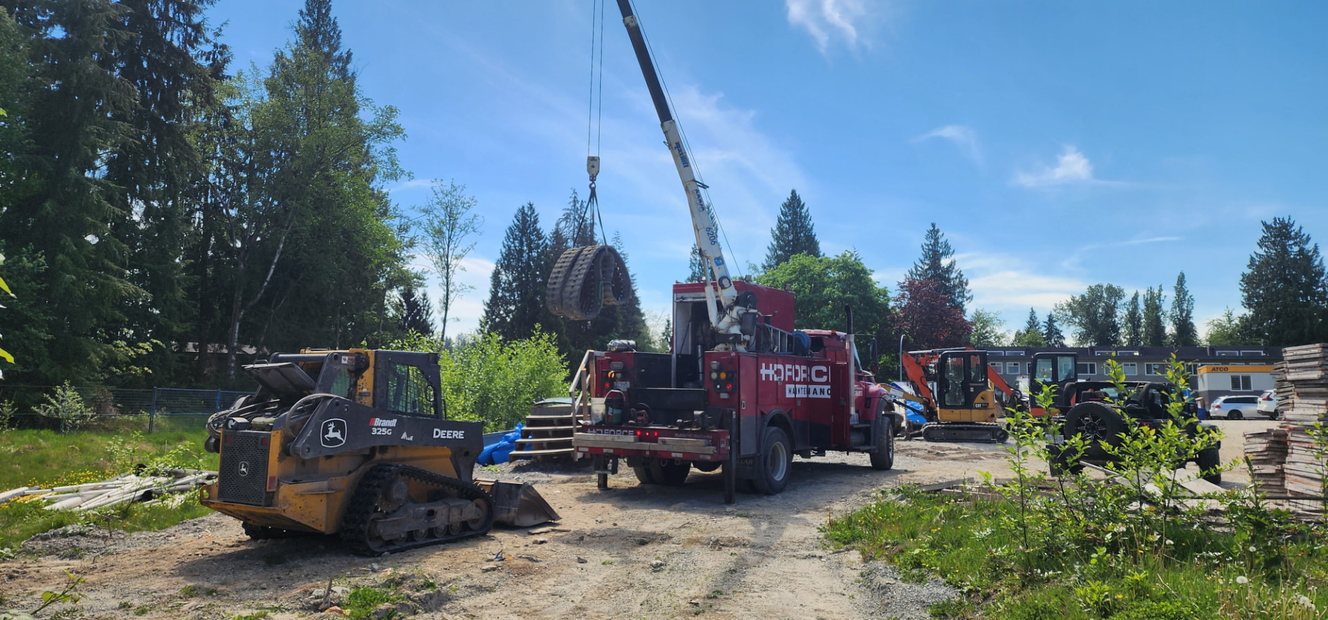 John Deere skid steer track replacement on site